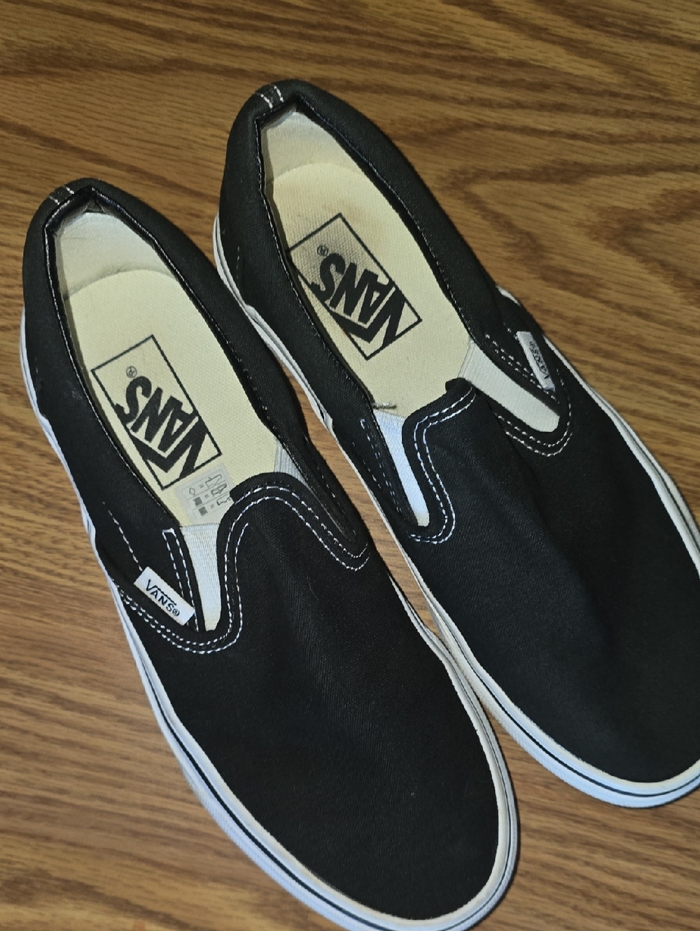 Vans Black and White Slip-On Canvas Sneakers